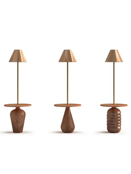 A product showcase of three lamp and table combinations from the 'Bernard and friends' collection. Each piece features a uniquely turned wooden base, celebrating the artistry of woodturning and natural forms.