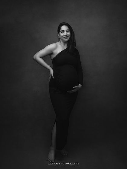 A full-length view in the same gown, showing her confident stance and the beautiful simplicity of the shot.