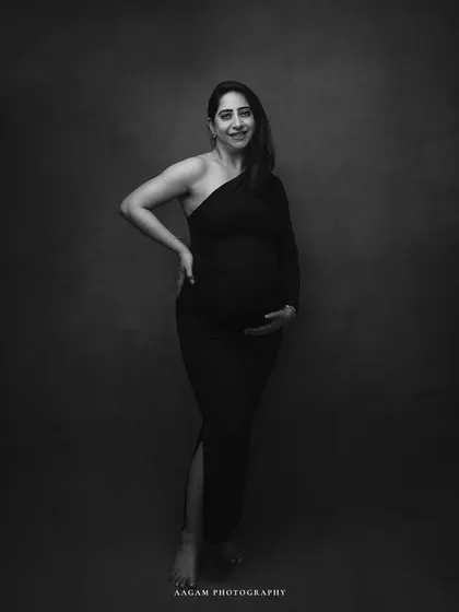 A momentary pause in time. This classic black and white maternity portrait is the epitome of grace and elegance.
