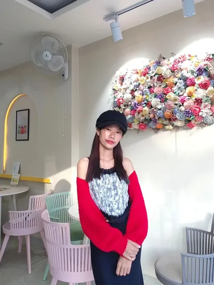 Modeling the red bolero in a beautiful cafe. It's a stylish and unique piece that shows the potential of crochet apparel.