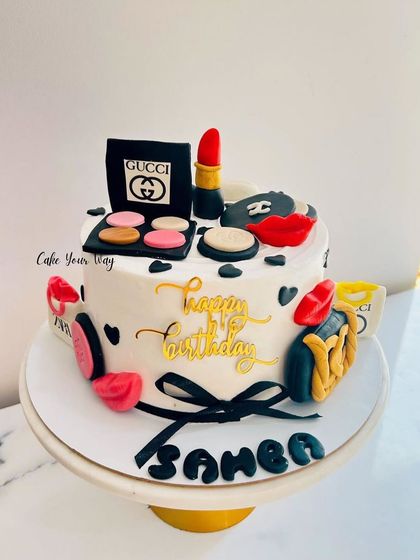 Serving style, sass, and sweetness. A glam cake for a fashionista, with fondant makeup and designer bags.