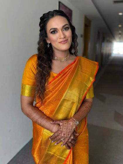 Another angle of this beautiful South Indian look. The makeup is kept soft and glowing to complement the vibrant yellow of her Kanjeevaram saree.