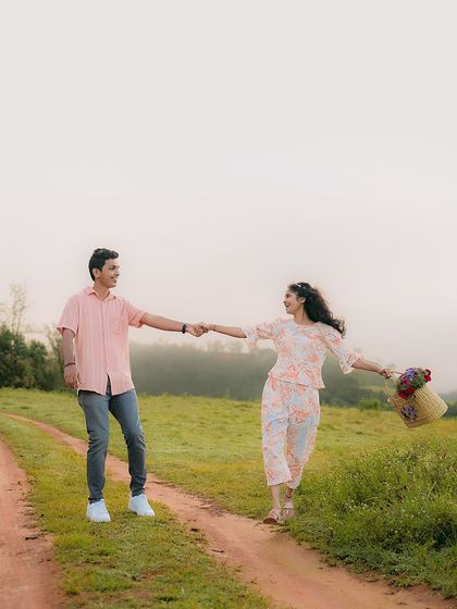 A fun, interactive pose on the dirt path. These playful moments showcase the couple's unique chemistry.