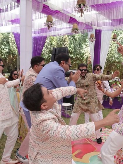 The chaos and fun of a Haldi ceremony. I'm right in the middle of it, leading a dance and making sure everyone is having a blast.