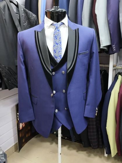 A collection of our designer suits, showcasing a variety of colors, fabrics, and custom details like embroidery, unique lapels, and accessories. Each piece is crafted to make a lasting impression.