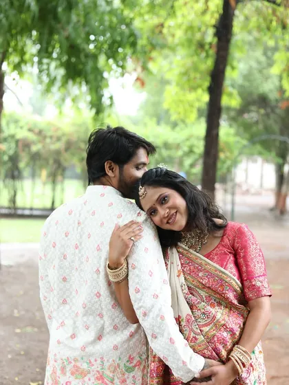 An intimate and loving moment between the couple. Her makeup is soft and pretty, highlighting her happiness.