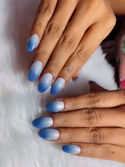 The sky's the limit for these blue ombre nails. This design features a seamless gradient from a soft white to a beautiful sky blue.