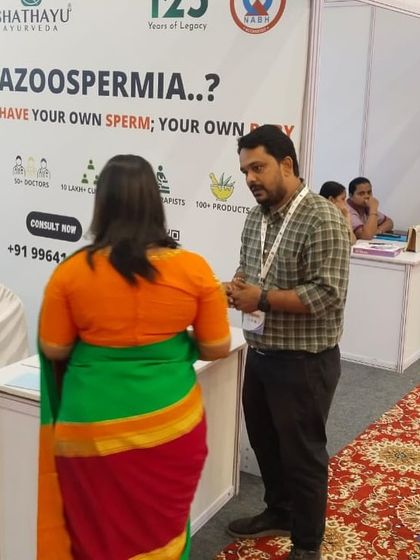 Here I am at a "Path to Parenthood" event, consulting with a couple about their fertility journey. I believe in educating and empowering individuals with holistic health options, discussing how Ayurveda can harmonize the mind and body to support natural conception.