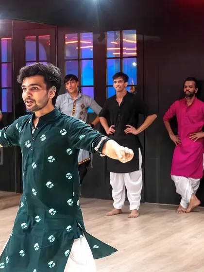 Leading the class through a sequence during the intensive workshop. Here, I'm demonstrating the correct posture and arm placement, key elements for mastering clean and powerful spins.