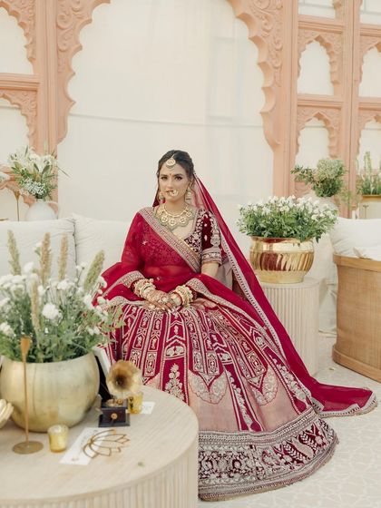 A quiet moment amidst the grandeur. Janvi's makeup was designed to look flawless both up close and from a distance, with a focus on luminous skin and softly defined eyes.