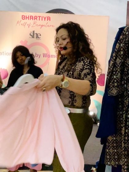 Choosing the right colors is crucial. In this workshop, I'm holding up a soft pink top to explain how certain shades can brighten the complexion and create a fresh, youthful appearance.