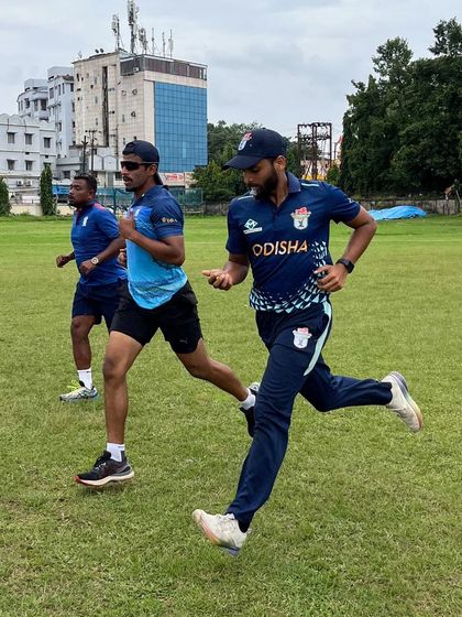 Running alongside my athletes during a drill. I believe in leading by example and being present in the trenches with them.