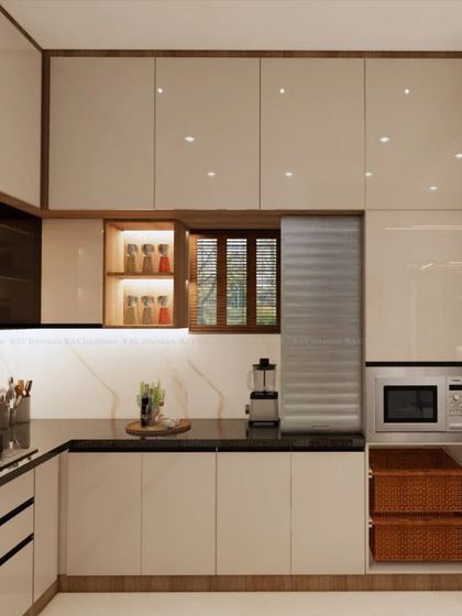 A close-up of the kitchen area, showing the built-in microwave, rolling shutter for appliances, and wicker baskets for vegetable storage.