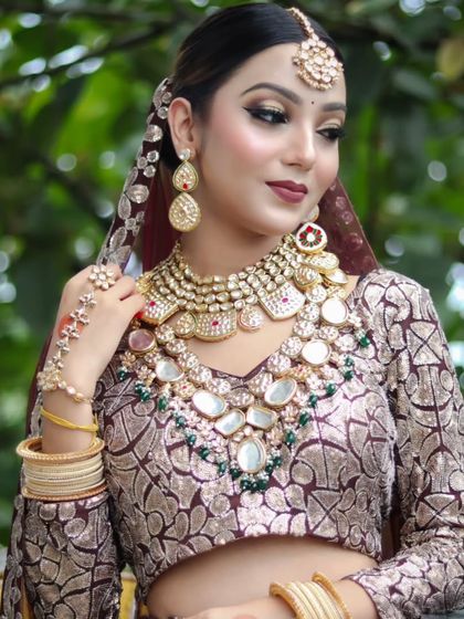 A bride wearing a unique printed lehenga with a heavy, oversized Polki necklace set. This shows how my jewellery can elevate any type of bridal outfit.