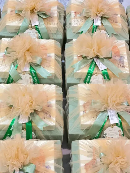 Here are the finished safari-themed return gifts, all wrapped and ready to go. Each box is enveloped in soft tulle and tied with a personalized ribbon, creating an exciting and beautiful present for young guests.