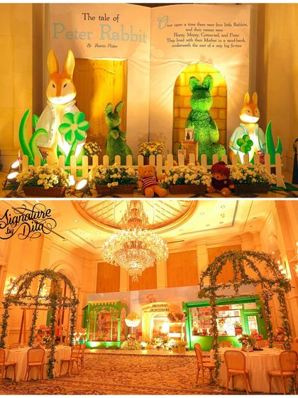 This party blended two classic themes: a London-style teddy bear picnic and Peter Rabbit. The backdrop features a giant storybook, and the hall is filled with lush greenery and elegant arches.