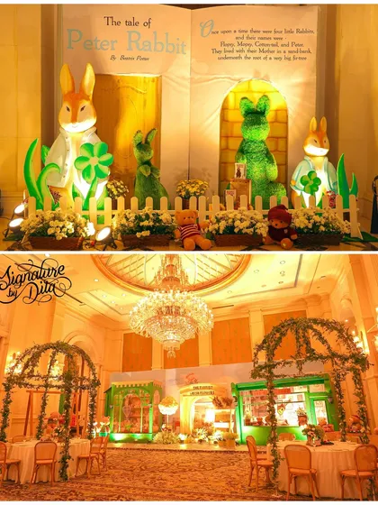 This party blended two classic themes: a London-style teddy bear picnic and Peter Rabbit. The backdrop features a giant storybook, and the hall is filled with lush greenery and elegant arches.