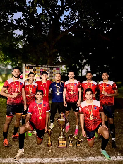 The team celebrating their win at the Dwarka 8v8 Championship.