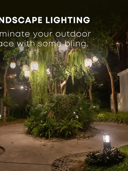 Landscape lighting is essential for enjoying your garden at night. In this design, hanging lanterns and subtle uplighting on trees create a warm, inviting ambiance, highlighting the garden's best features and extending its usability into the evening.