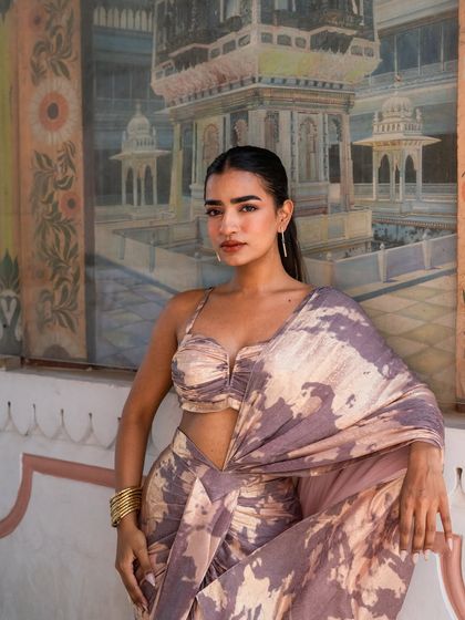 Part of our Pastel Pink Edit, this printed drape saree is a unique and artistic choice.