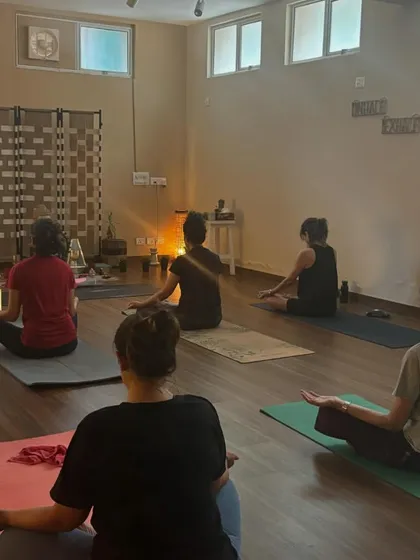 The class sits for meditation, a quiet and powerful moment of collective stillness that is the culmination of our physical practice.