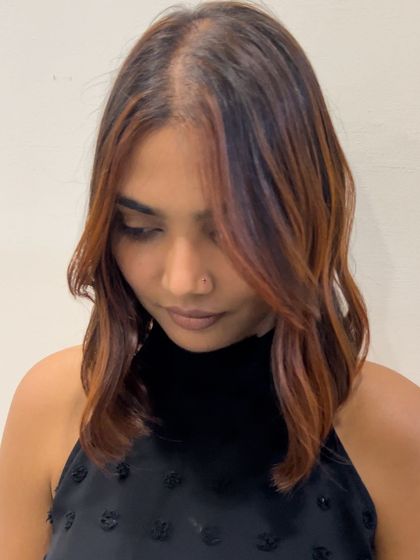 This shot shows how the face-framing highlights brighten up her complexion. It's a great way to add impact with minimal coloring.