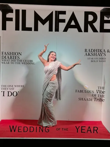 Another playful pose inside the 'Wedding of the Year' photo booth.