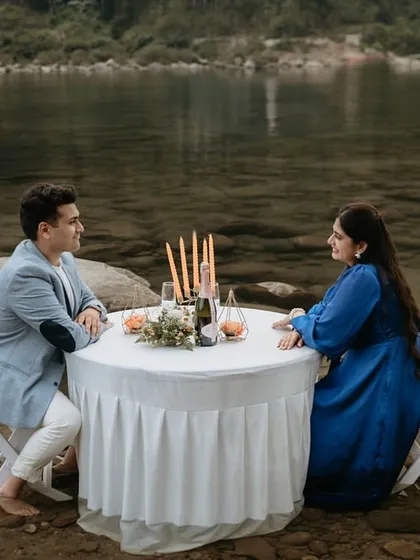 A uniquely crafted romantic setup with a candlelit table for two in the crystal-clear waters of Meghalaya. This shot demonstrates our ability to create and capture luxurious, one-of-a-kind pre-wedding experiences.