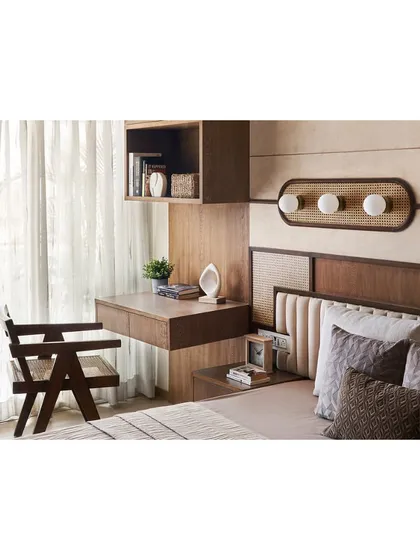 The study area in the parent's bedroom, perfectly positioned to catch natural light from the window.