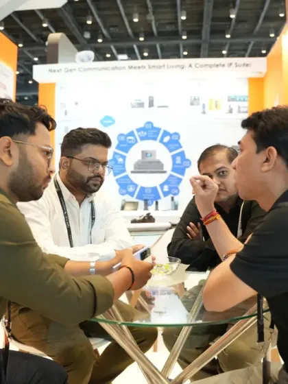 A business meeting in progress at a booth's dedicated seating area. We encourage exhibitors to design stalls that facilitate both product demos and private business discussions.