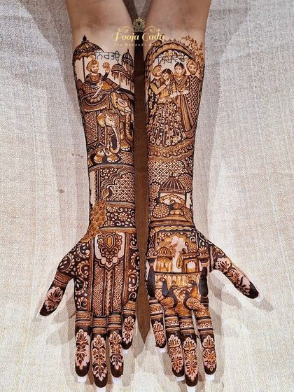 A heavy bridal henna for a Punjabi bride, featuring a grand baraat scene with elephants and a beautiful family portrait.