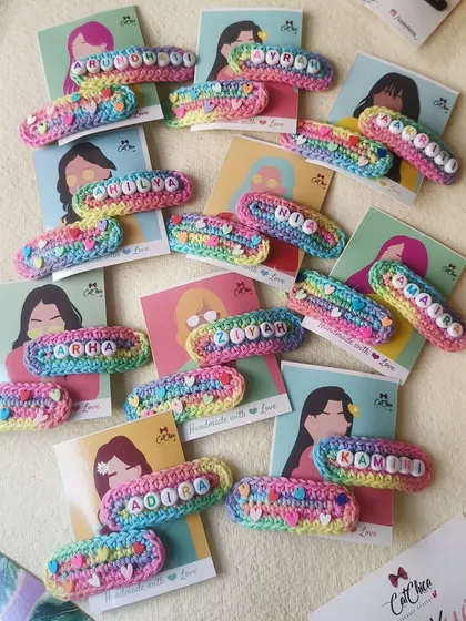 A table full of our unicorn name clips! This shows just how popular they are for birthday party return gifts. Each one is unique and made with care.