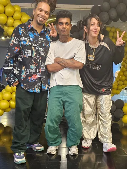 A duplicate of our founders with one of our top b-boys.