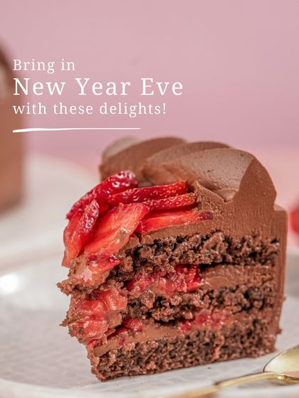 A slice of my Strawberry Ganache cake, highlighted as a delightful option to bring to a New Year's Eve party.