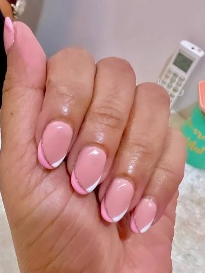 Another look at these perfect French gel nails with a delicate glitter line. It's a simple way to elevate a classic style.