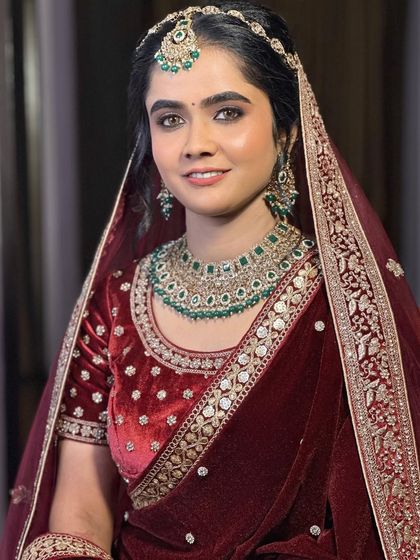 The bride's happy and confident smile says it all. The makeup is tailored to make her feel beautiful and comfortable on her big day.