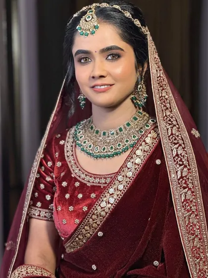 The bride's happy and confident smile says it all. The makeup is tailored to make her feel beautiful and comfortable on her big day.