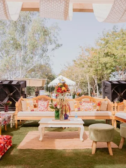 A wide shot of a lounge area at the 'Rajasthani Folklore' Mehendi, showing how we mix and match furniture and textiles to create an eclectic, curated look.