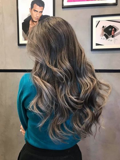 An example of my signature ash balayage on long hair. The cool tones and seamless blending create a high-end, polished look.