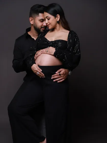 The quiet moments are often the most powerful. Here, we focused on the intimate connection between the parents-to-be in a modern, chic studio setting. It’s a simple pose that speaks volumes about their shared anticipation and love.