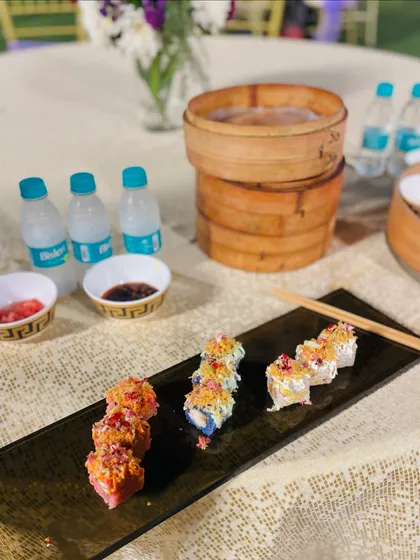 Another perspective of the elegant sushi presentation, ready for guests to enjoy at their tables.