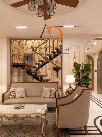 A neo-classical living room with ornate furniture, a decorative metal screen for the staircase, and intricate flooring with a black and white inlay.