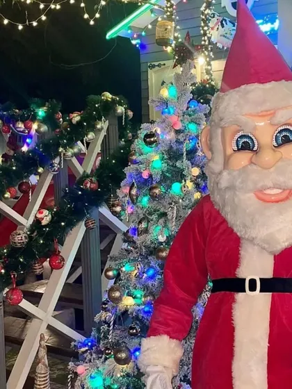 Get into the festive spirit with our Santa Claus mascot. Here he is at a private Christmas party, bringing joy to a family's home. This is a high-quality costume with a professional performer, perfect for Christmas and New Year events.