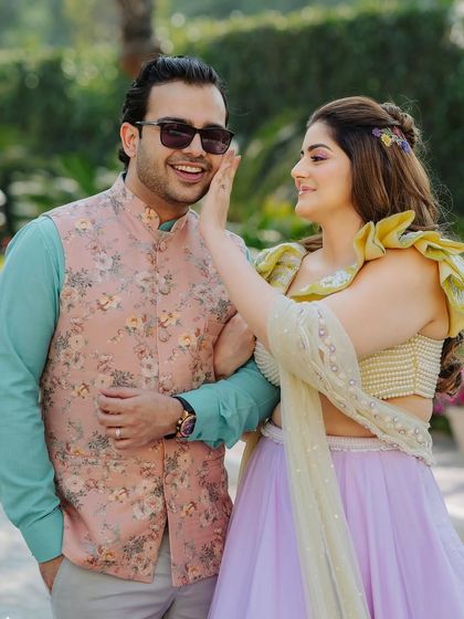 A playful and happy moment. The makeup is designed to be fun and light, perfect for a daytime event filled with laughter and dancing.