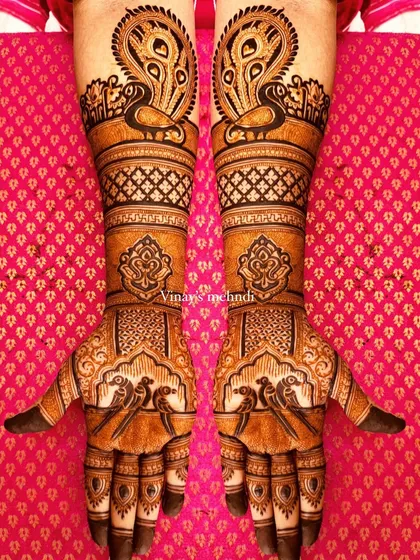A perfectly symmetrical design for both hands, showcasing majestic peacocks and delicate parrots. Achieving symmetry is a crucial skill that we practice extensively in my classes.