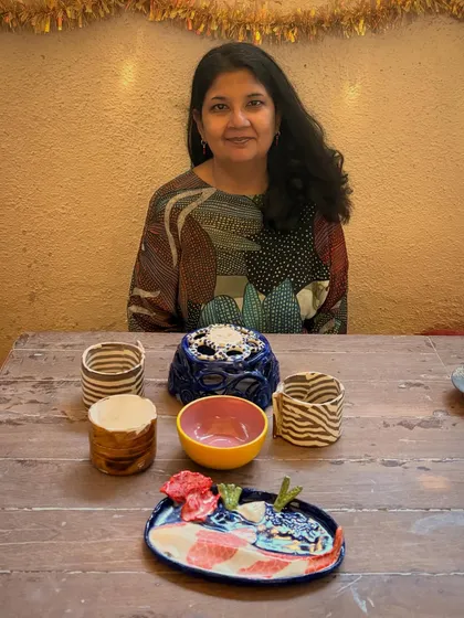 This student's quiet patience and steady curiosity shine through in these beautiful pieces from her beginner's course. The whimsical koi pond platter is a favorite, full of texture and calm joy.