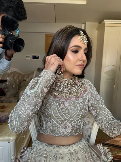 A candid moment during the getting ready process. You can see the highlights in her hair, which are beautifully accentuated by the flowing waves.