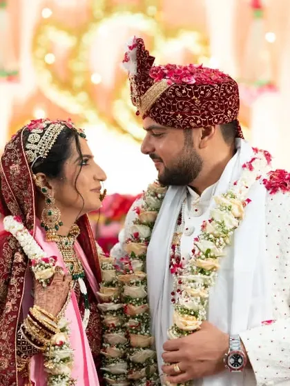 A beautiful shot of the couple exchanging a look of love during their wedding ceremony.