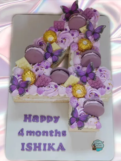 A number '4' monogram cake to celebrate a baby's 4-month milestone. The purple theme with butterflies and Ferrero Rocher makes it extra special.
