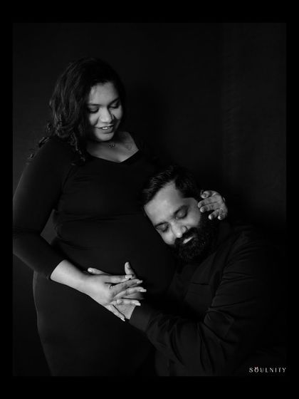 Listening to the tiny heartbeats of a new world. This classic black and white portrait is so full of emotion and tenderness.